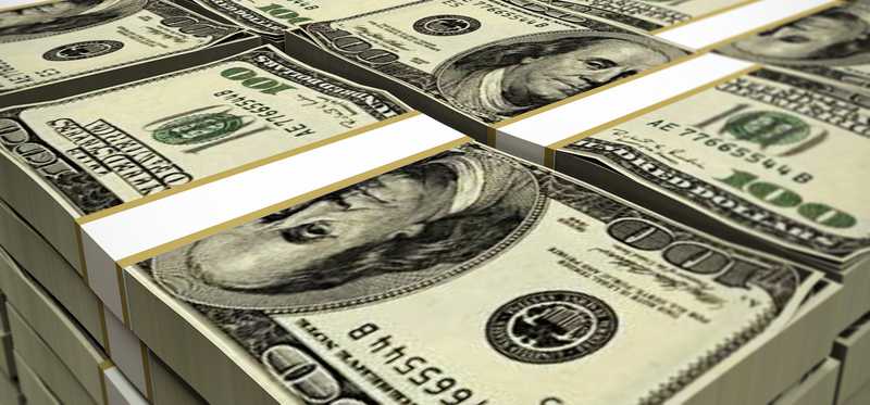 Stacks and rows of hundred dollar bills.