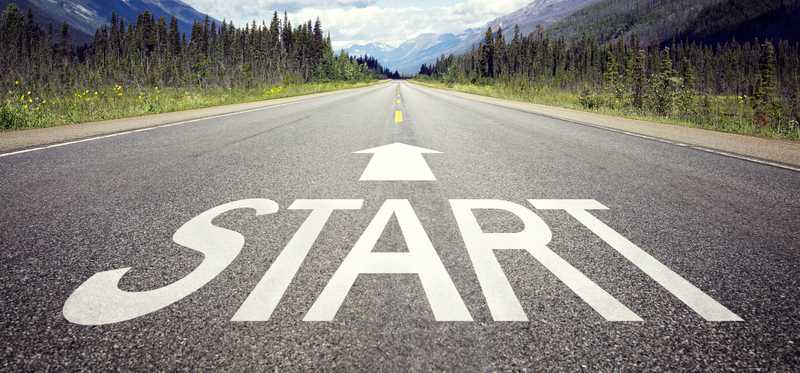 A street has the word Start written on it with an arrow pointing forward.