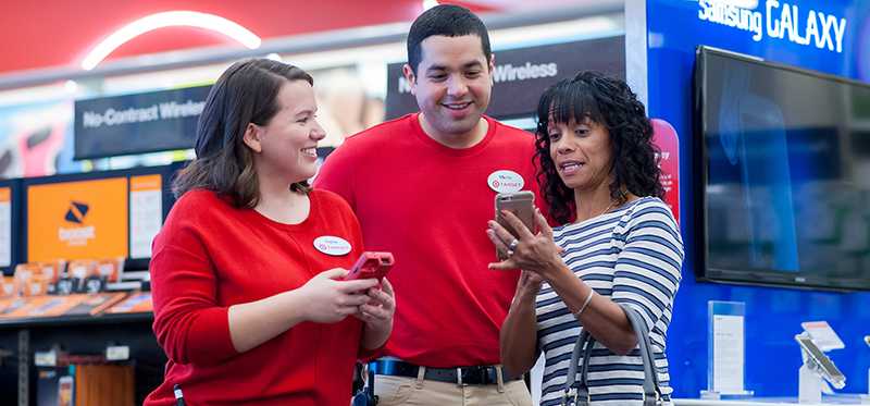 Target store employees speaking with a customer.