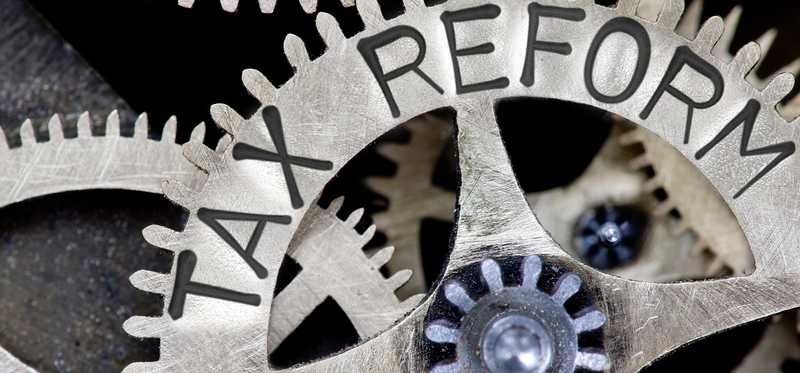 Tax reform written on metal gears.