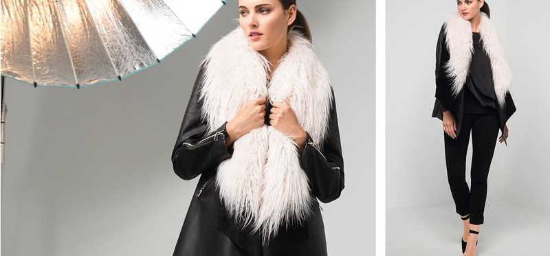 A woman being photographed in a fur stole