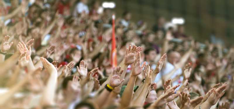 A stadium packed full of cheering fans
