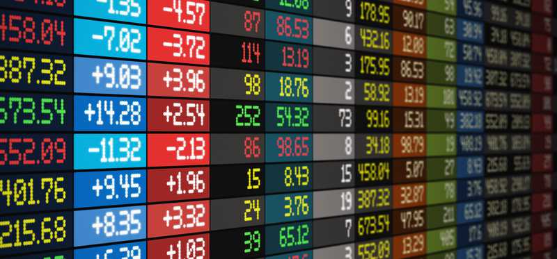 Stock charts on an electronic board.