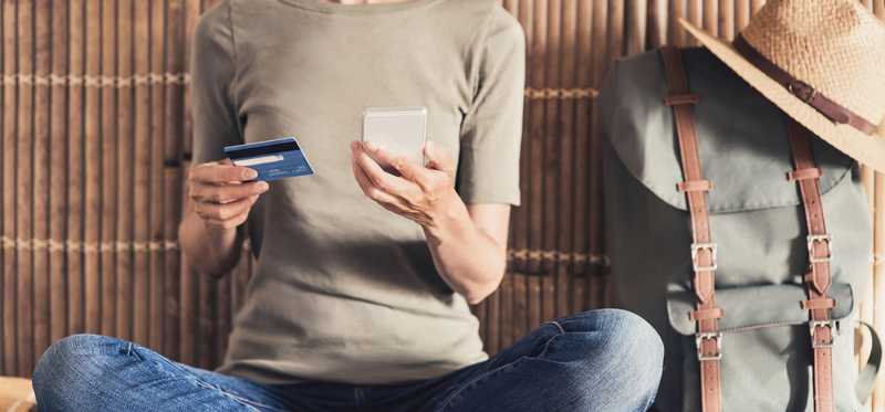 Traveling woman using credit card