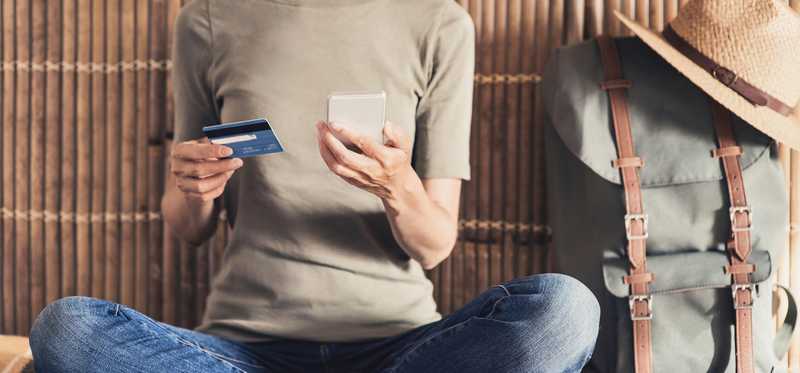 Traveling woman using credit card