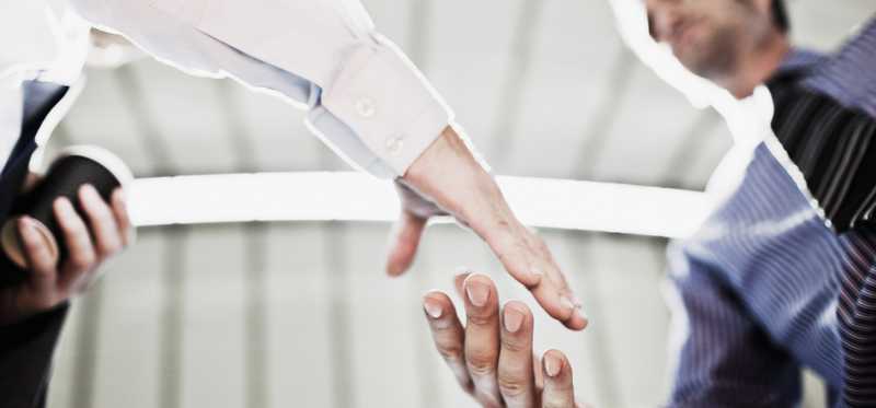 Two men shaking hands.