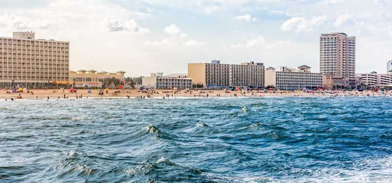 Nice image of wind-whipped waves and the Virginia Beach skyline.