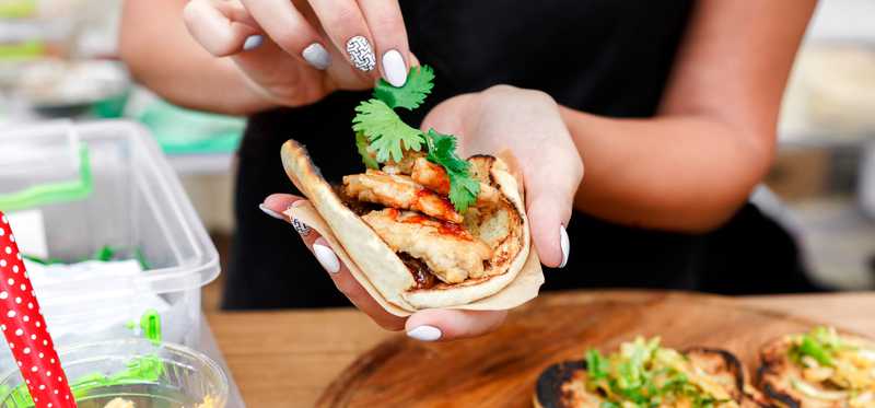 A woman prepares food.