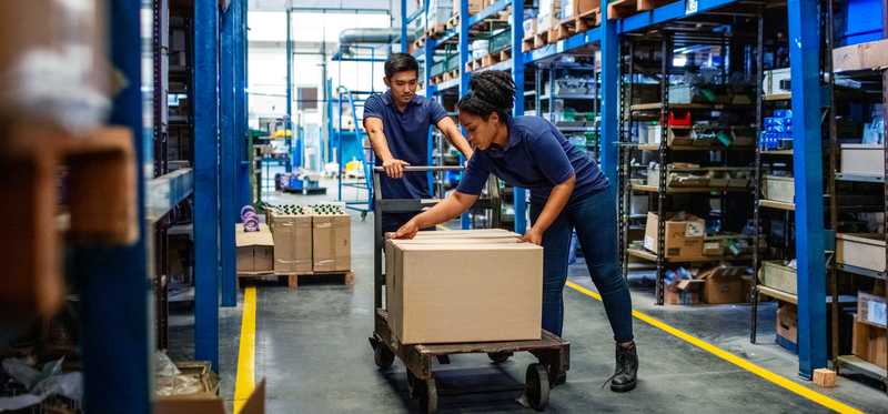 People working in a warehouse.
