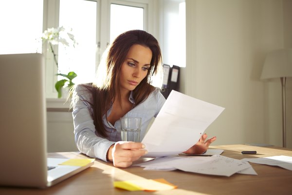 Woman reviewing financial documents