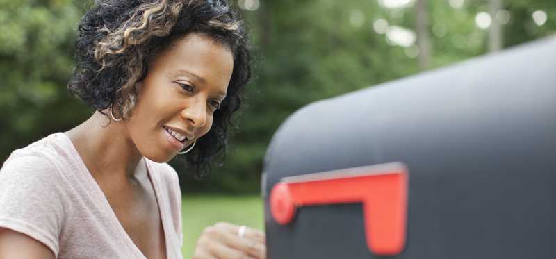Person opening mailbox.