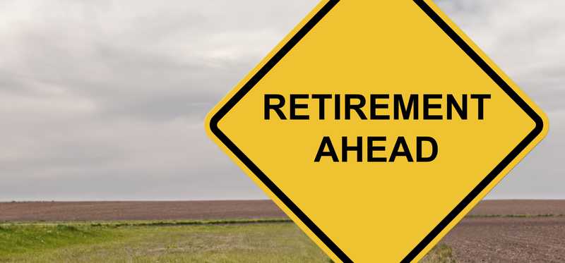 A yellow road sign that says retirement ahead.