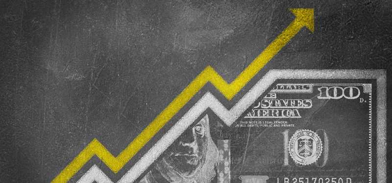 Arrow rising over hundred dollar bill