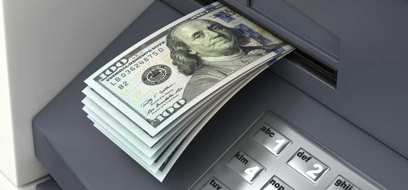ATM cash withdrawal of hundred dollar bills.