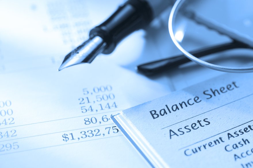 balance sheet with a fountain pen