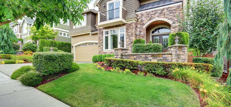Beautiful new home with nice green lawn.