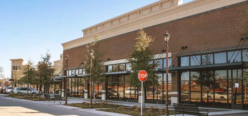 The exterior of a big store at a shopping center.