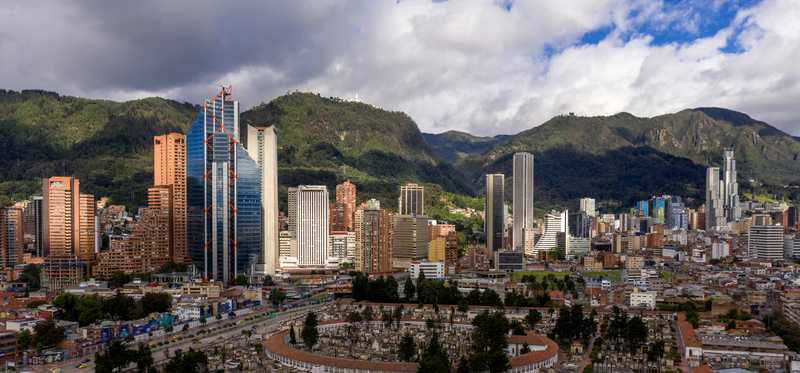 The Bogota skyline with mountains in the background.