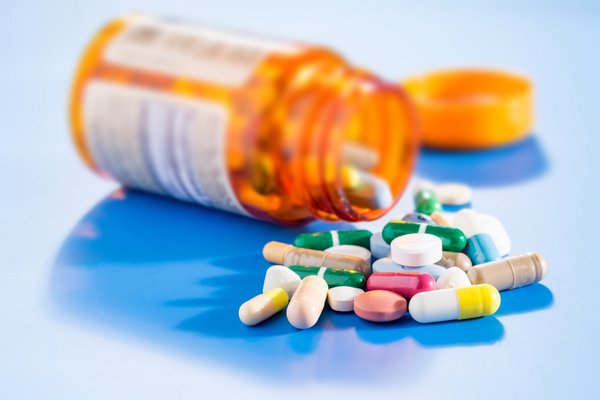A bottle of pills spilled over.