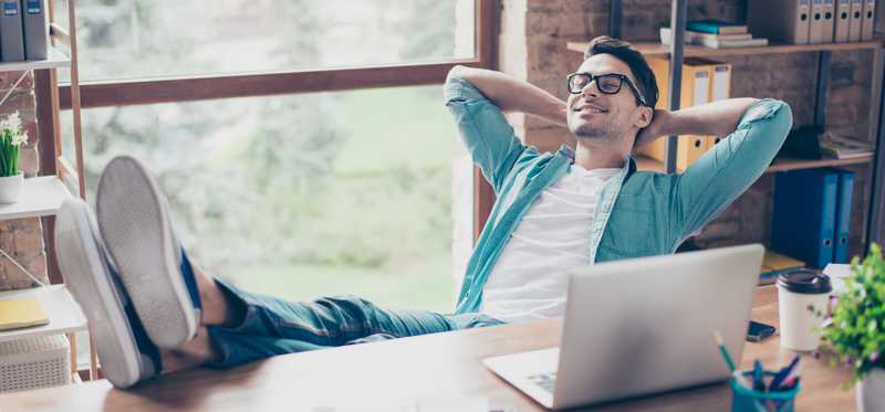 Man taking break from working on laptop