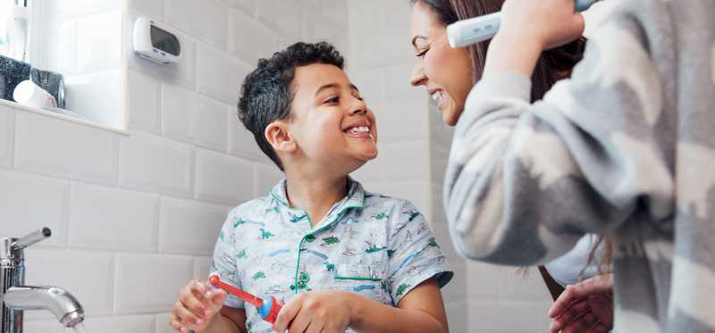 A child brushes his teeth.