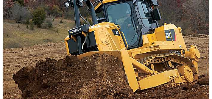 Caterpillar bulldozer leveling the ground.