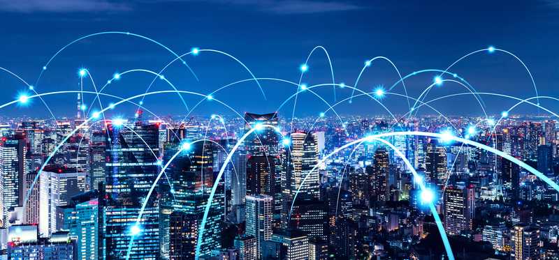 City at night with wireless network
