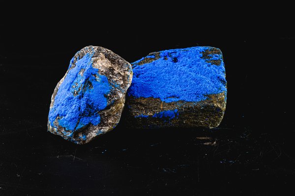 Two pieces of blue cobalt ore.