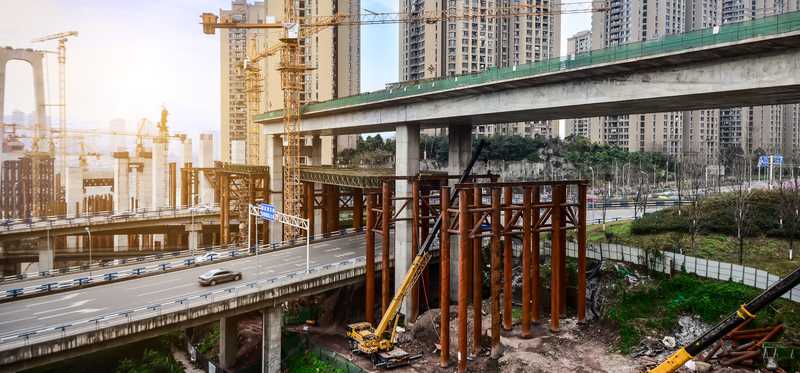 A construction site with cranes.