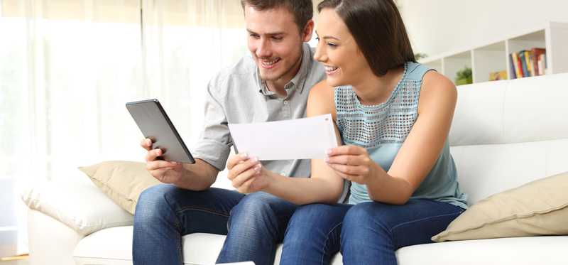 Two people review paperwork together.