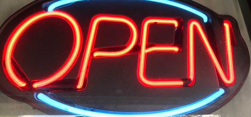 Neon Open sign lit up.