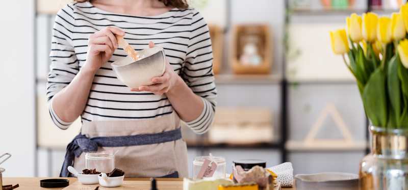 Woman stirring mixture in bowl