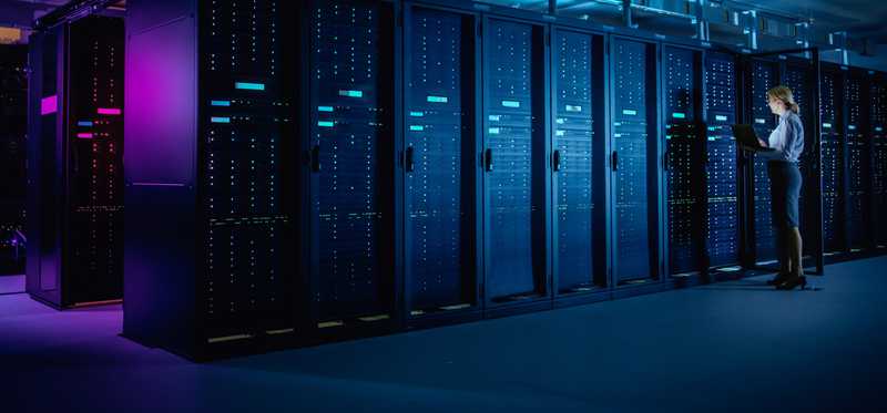Worker in data processor room