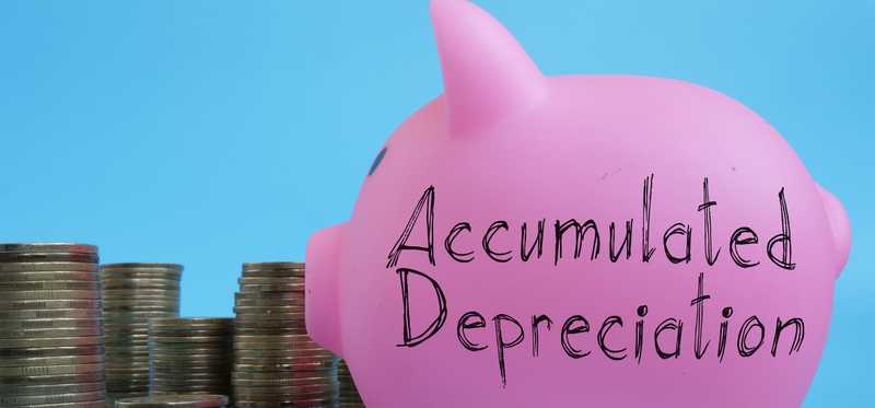 A piggy bank, stacks of coins, and the words Accumulated Depreciation.