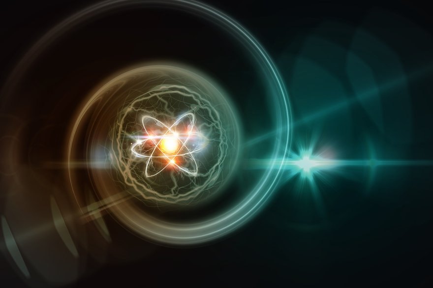 digital image of an atom with a glowing nucleus.
