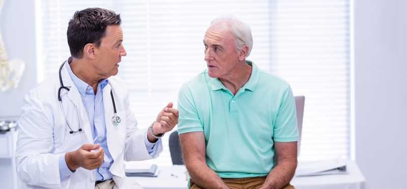 A doctor talking to a patient.