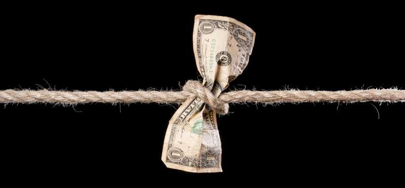 Dollar bill tied with rope