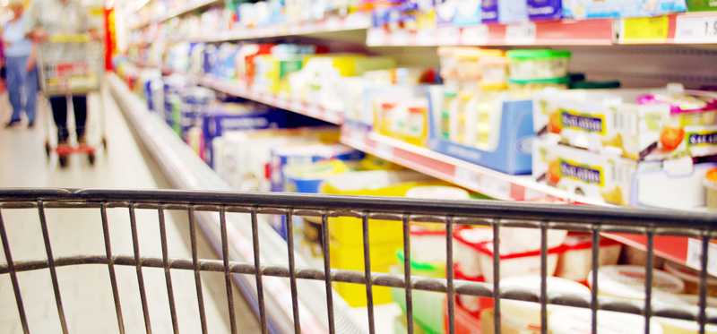 Cart going down a store aisle.