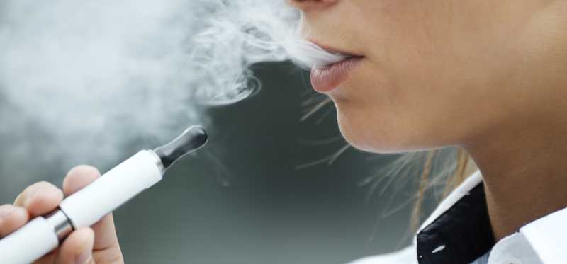 A person using an electronic cigarette.