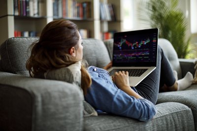 female trader using laptop