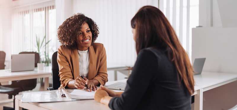 Businessperson with a client.