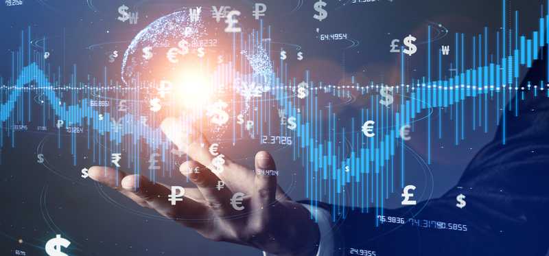 A hand with fintech and global currency symbols surrounding a stock chart floating above it.