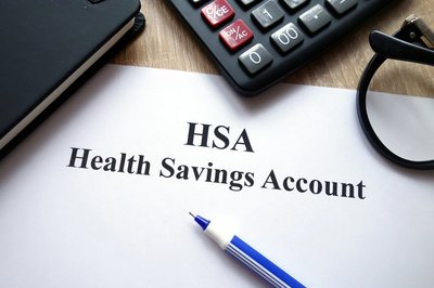 HSA document on a desk next to a pencil and calculator