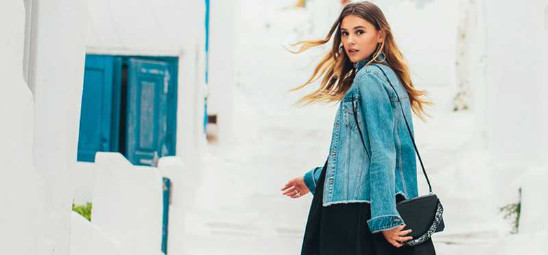 Fashionable woman looking back at camera.