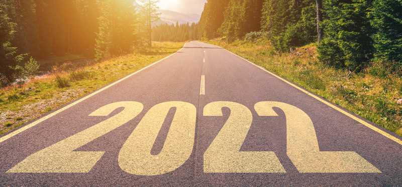 2022 painted on a tree-lined highway.