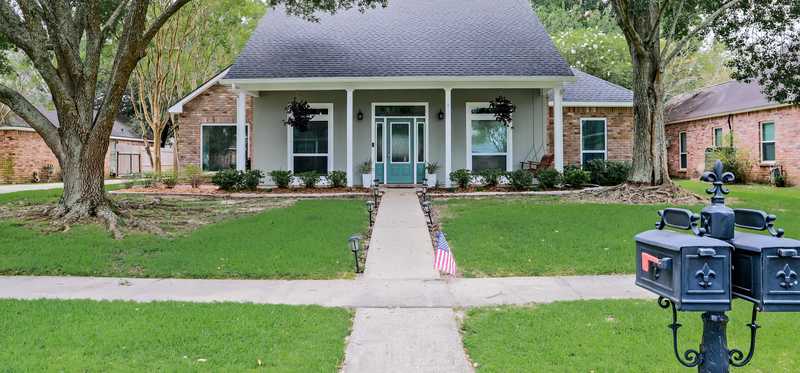 Pretty single-family house with a turquoise door.