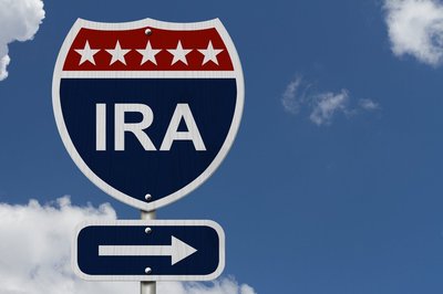 Highway exit sign reading "IRA" pointing to the right
