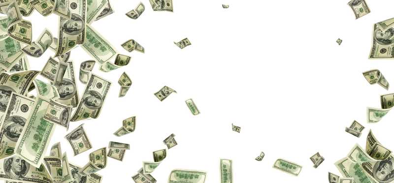 Hundred dollar bills flying in air