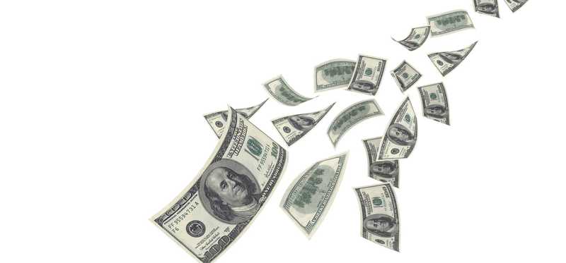 A stream of hundred dollar bills falling from the sky.