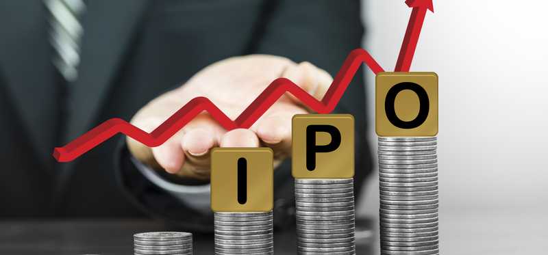 Stacks of coins in increasing size with Blocks on top that spell out IPO.